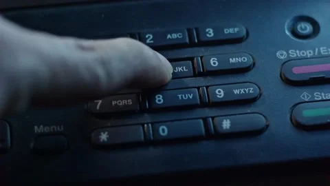 Close-up of a finger pressing numeric buttons on a photocopier machine cont.. Stockbeeldmateriaal 338225865