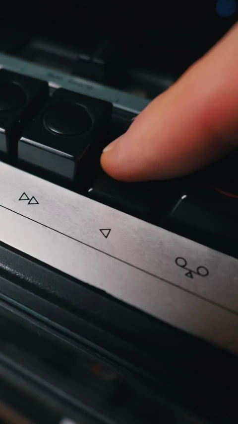Close Up of Finger Pressing Play Button on Retro Audio Cassette Deck Stock Footage 333818971