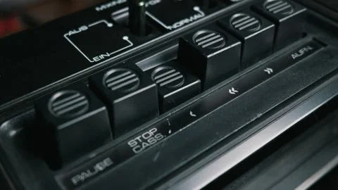 Close-Up of a Finger Pressing the Play Button on a Vintage Tape Recorder Stock Footage 333820169