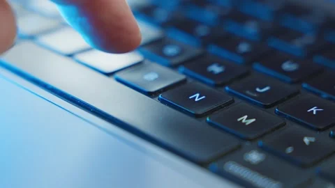 Close up on finger pressing the space bar key on laptop computer keyboard in Stock Footage 345089483