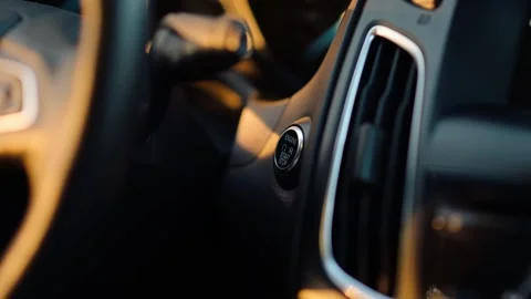 Close-up of Finger Pressing a Start Engine Button. Starting a Car Stock Footage 253074293