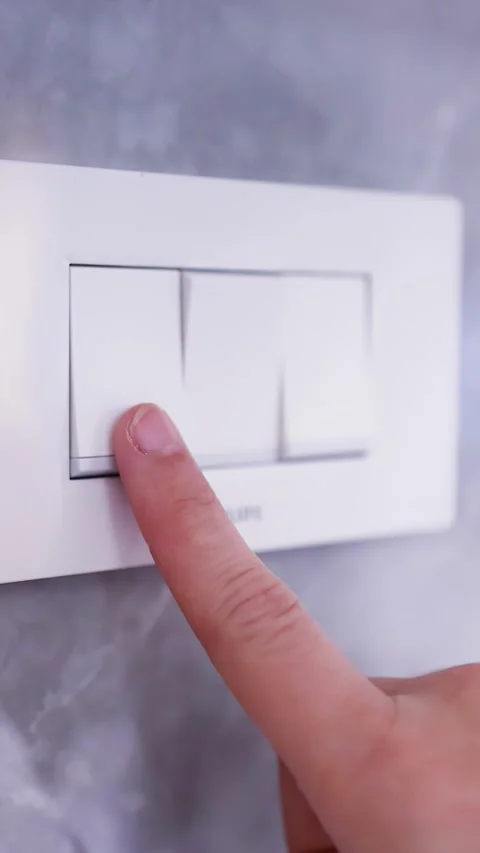 Close Up of Finger Pressing White Light Switches on Wall Stock Footage 333165274