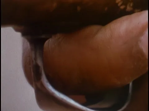 Close-up of finger pulling trigger to set off cave explosion Stock Footage 260254978