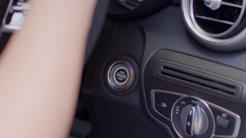 Close up finger push the engine button to start or stop on car.Driver start e Stock Footage 161005487