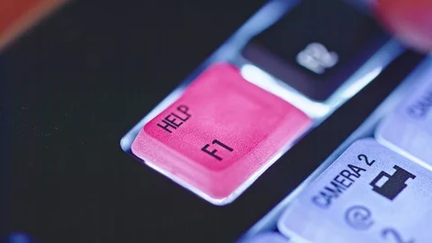 Close up of finger pushing the red help button on a backlit keyboard Stock Footage 92773007