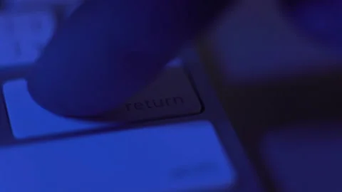 Close-up, finger quickly and many times presses the key of the keyboard return Stock Footage 150465345