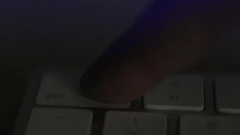 Close-up, finger quickly and many times presses the key of the keyboard esc Stock Footage 150482836