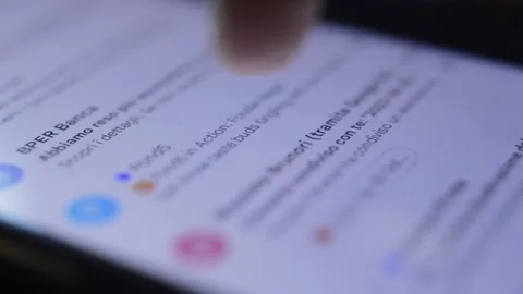 Close.up finger scrolling e mail on his phone. google e mail app on iphone Video stock 202081399