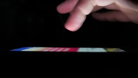 Close-Up Finger Touch Screen Smartphone Tablet Display, Night Web Navigation Stock Footage 100070528