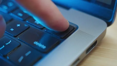 Close up on finger touching a fingerprint scanner on laptop computer at night Stock-Footage 345110601