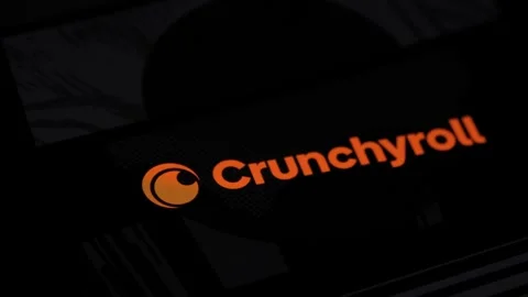 Close up of finger touching smartphone screen and opening Crunchyroll app and Stock Footage 294498850