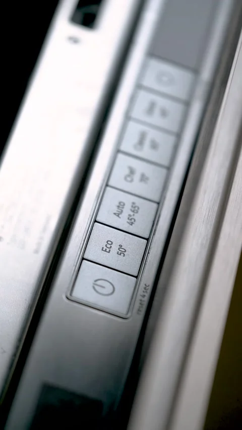 Close-up of finger turning on in eco function a modern dishwasher. 動画素材 234176696