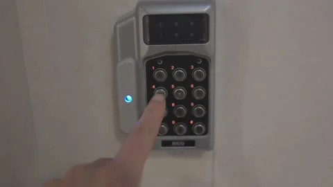 Close up of finger using door entry lock Stock Footage 153271101