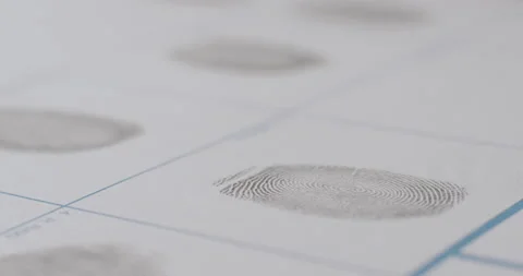 Close-Up Of Fingerprint Being Applied To White Paper Stock Footage 188427428