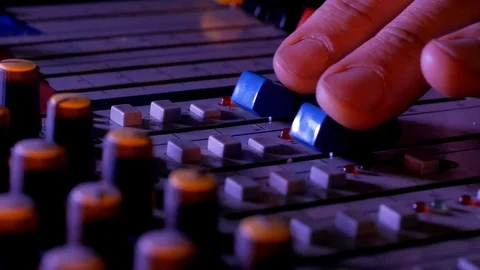 Close-up of fingers and knobs on sound control panel during music recording 스톡 동영상 90626955