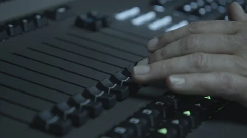 Close-up of fingers and knobs on sound control panel during a live-show. 動画素材 113322484