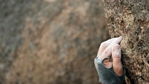 Close-up of the fingers of a climber holding on to a flake. Stock Footage 147399989