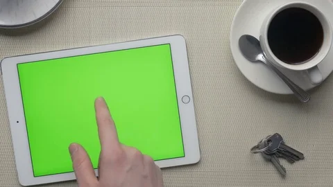 Close-up of fingers making touch gestures on a large green screen Stock-Footage 75458836