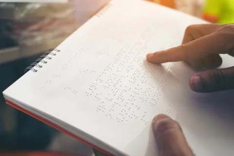 Close-up of fingers reading braille, Hand of a blind person reading some brai Stock Photos
