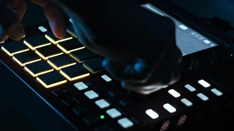 Close-up of Fingers Tapping Glowing Beatmaker Pads Stock-Footage 312896609
