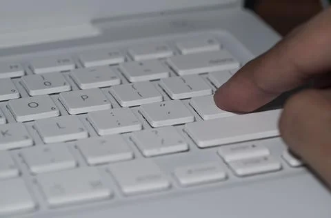 Close up on fingers texting on a computer keyboard Foto stock