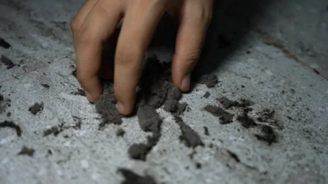 Close-up of fingers touching loose dirt on a rough white surface, Hand touc.. Video stock 338319404