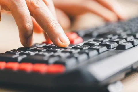 Close-up of fingers typing on computer keyboard for data entry and online w.. Stockfoto's