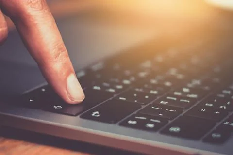Close up of fingers typing on keyboard Stock-Fotos