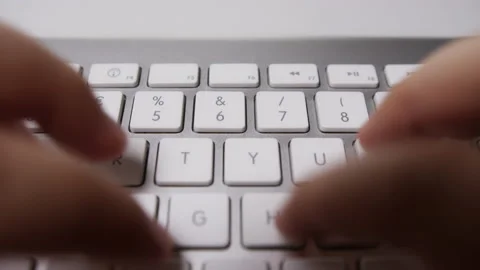 Close-up of Fingers Typing Something on White Keyboard Stock Footage 213892127