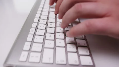 Close-up of Fingers Typing Something on White Keyboard Stock Footage 213892824