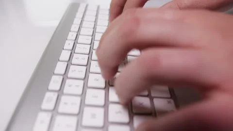 Close-up of Fingers Typing Something on White Keyboard Stock Footage 213893204