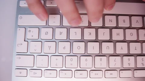 Close-up of Fingers Typing Something on White Keyboard Video stock 213895123