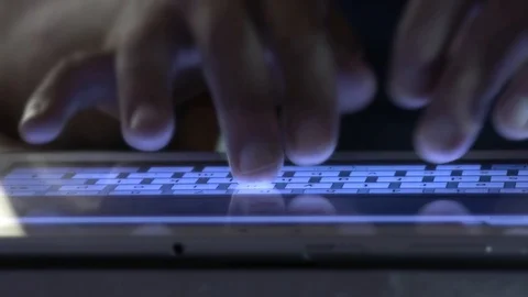 Close Up of Fingers Typing on Tablet in Dark Environment Digital Work Concept Stock Footage 90731904