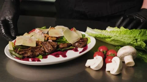 A close-up of a finished dish being spun around by the chef. It's a salad made Stock Footage 236507201