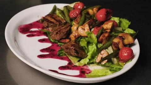 A close-up of a finished dish being spun around by the chef. It's a salad made Stock Footage 278482124