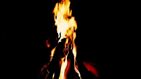 Close up fire burning in the fireplace. Video of fire flames over dark backgr Video stock 92239572