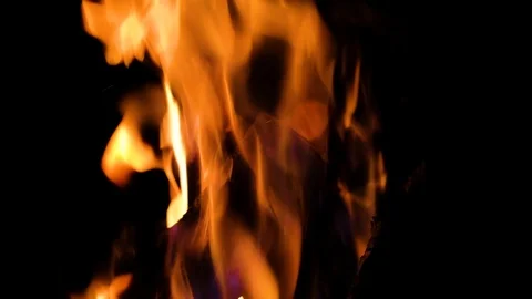 Close up fire burning in the fireplace. Video of fire flames over dark backgr Stock Footage 93890404