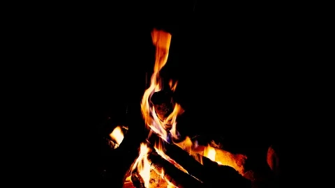 Close up fire burning in the fireplace. Video of fire flames over dark backgr Stock Footage 93944869