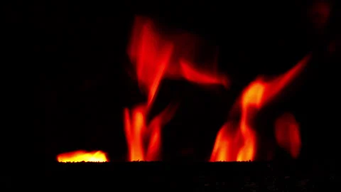 Close-up of Fire Burning Inside Metal Heating Boiler in Dark 動画素材 331505012