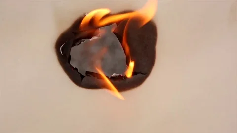 Close Up of Fire Burning Through Paper Stock Footage 81196977