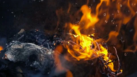 Close Up of Fire Burning Trash in a Backyard Brazier at Night Stock Footage 338993689