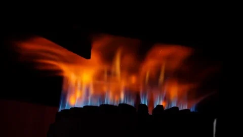  close up on fire burns under the pot- slow motion Stock Footage 80369370