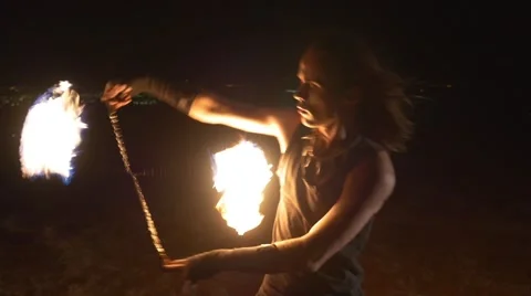 Close up of fire dancer performing with fire poi Stock Footage 67629008