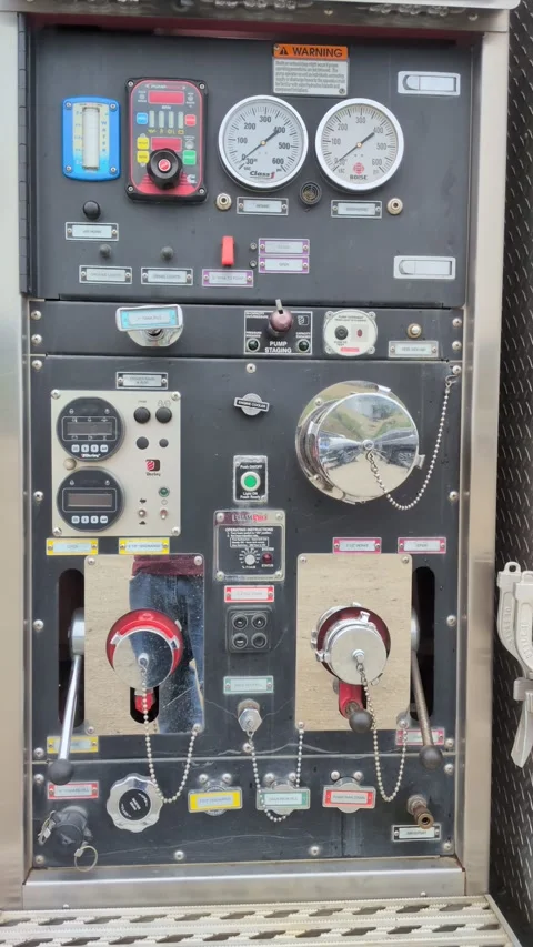 Close-up of a fire engine pump control panel featuring water pressure gauges Stock Footage 348044183