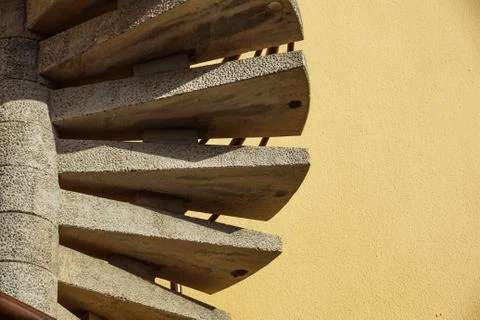 Close up of a fire escape on the wall at sunset Stock Photos