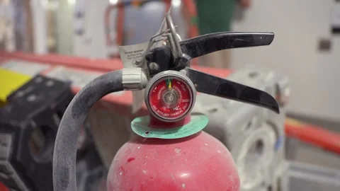 Close-Up of Fire Extinguisher in Workshop Stock Footage 314030703