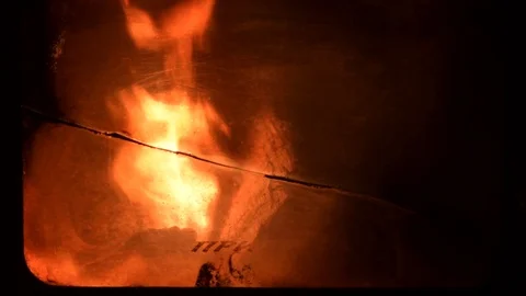 Close up of fire in a fireplace in the night with very shallow focus area. Stock Footage 96364590