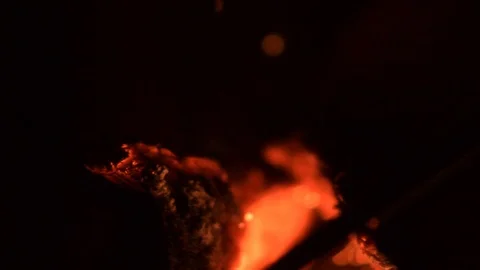 Close up of fire in a fireplace in the night with very shallow focus area. Video stock 96364887