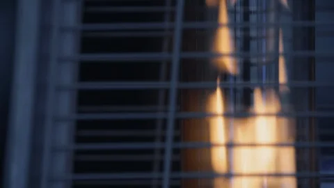 Close-up of fire flame in burning gas heater outdoors in the street Stock Footage 123338681
