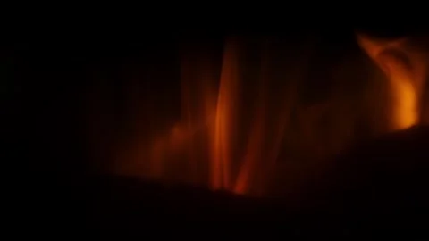Close up fire flames filmed in slow motion as they travel along surfaces on.. Stock Footage 328282343